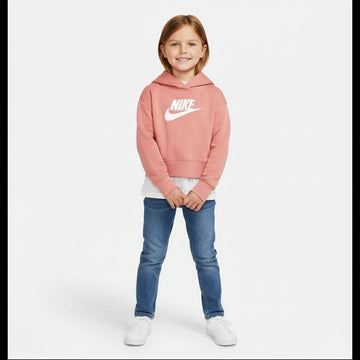 Child wearing a pink Nike hoodie and blue jeans on a white background