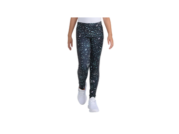 Person wearing black leggings with white speckles on a white background
