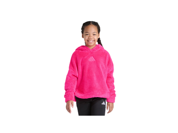 Girl wearing a pink Adidas hoodie and black pants on a white background
