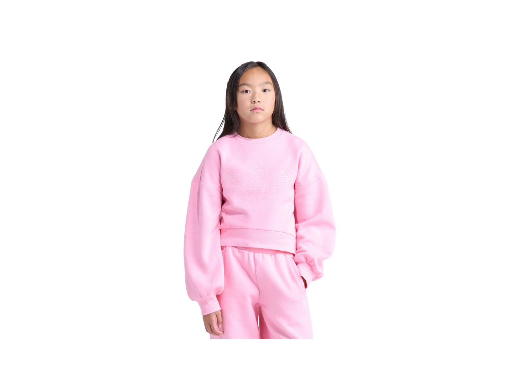 Person wearing a pink outfit on a white background