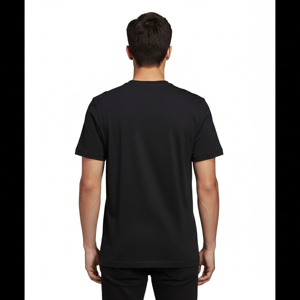 Person wearing a black Adidas t-shirt on a white background