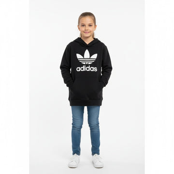 Kid wearing a black Adidas hoodie with a white logo on a white background