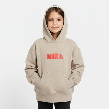Child wearing a beige Nike hoodie on a white background