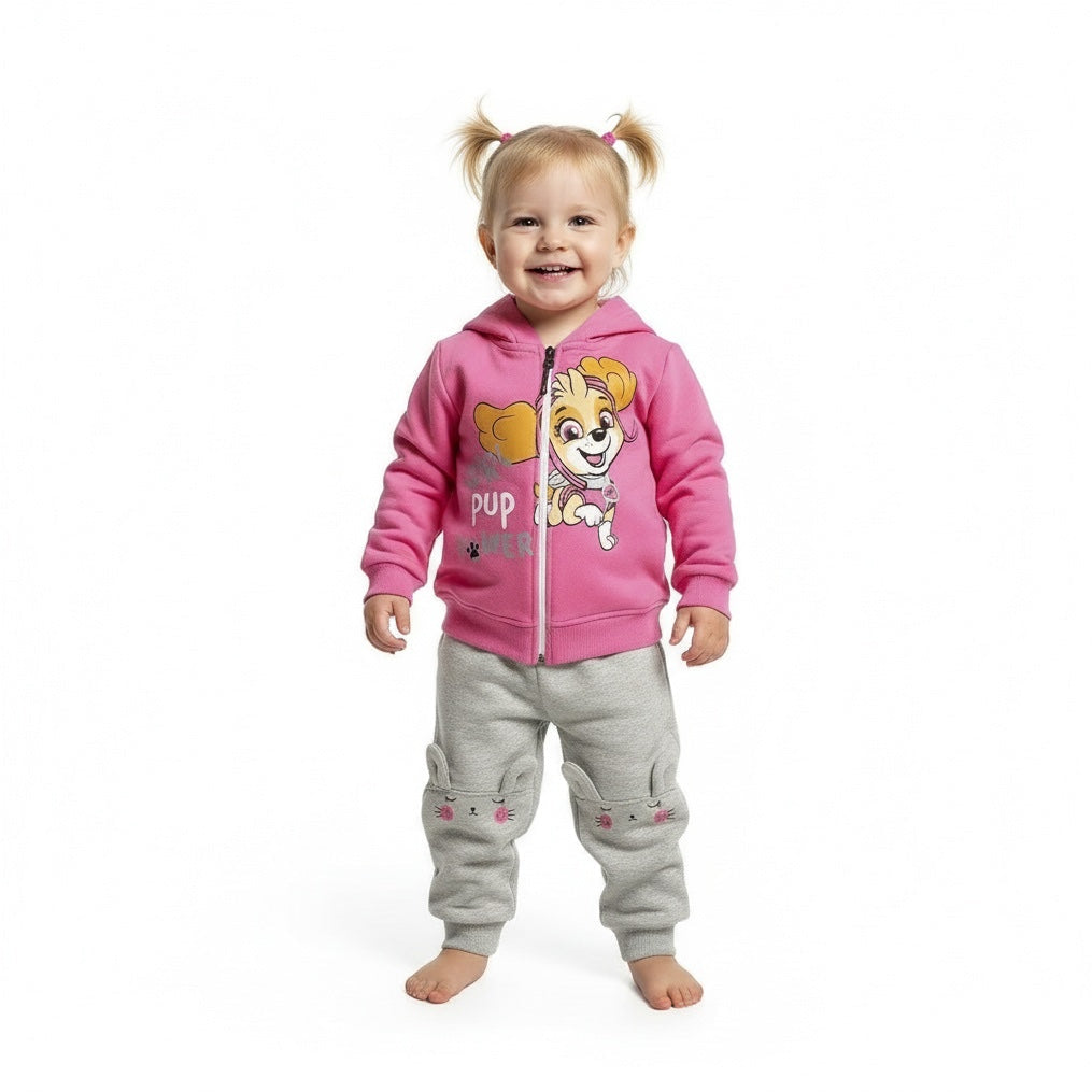 Child wearing a Paw Patrol pink hoodie with a cartoon character and gray pants on a white background