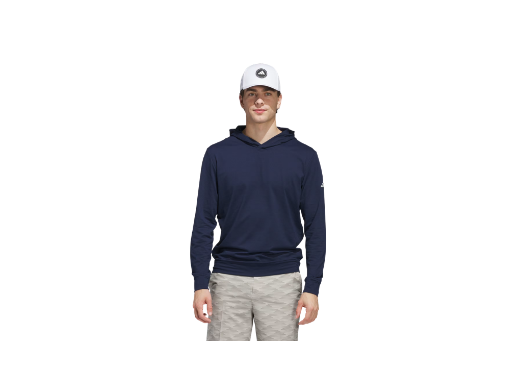 Man wearing a navy hoodie and light gray shorts on a white background