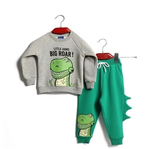 Children's outfit with gray sweatshirt and green pants featuring dinosaur graphics on a white background.
