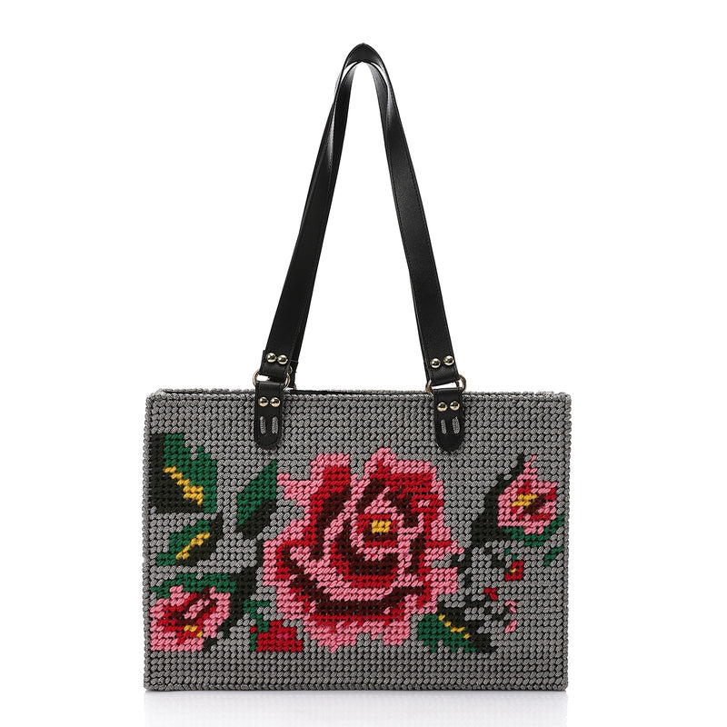 What's New brand handmade Handbag with floral embroidery on a white background